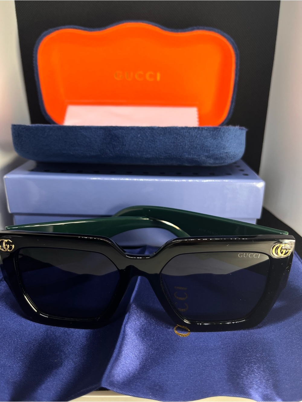Gucci Black Frame Sunglasses with Green Temples and Gold Accents